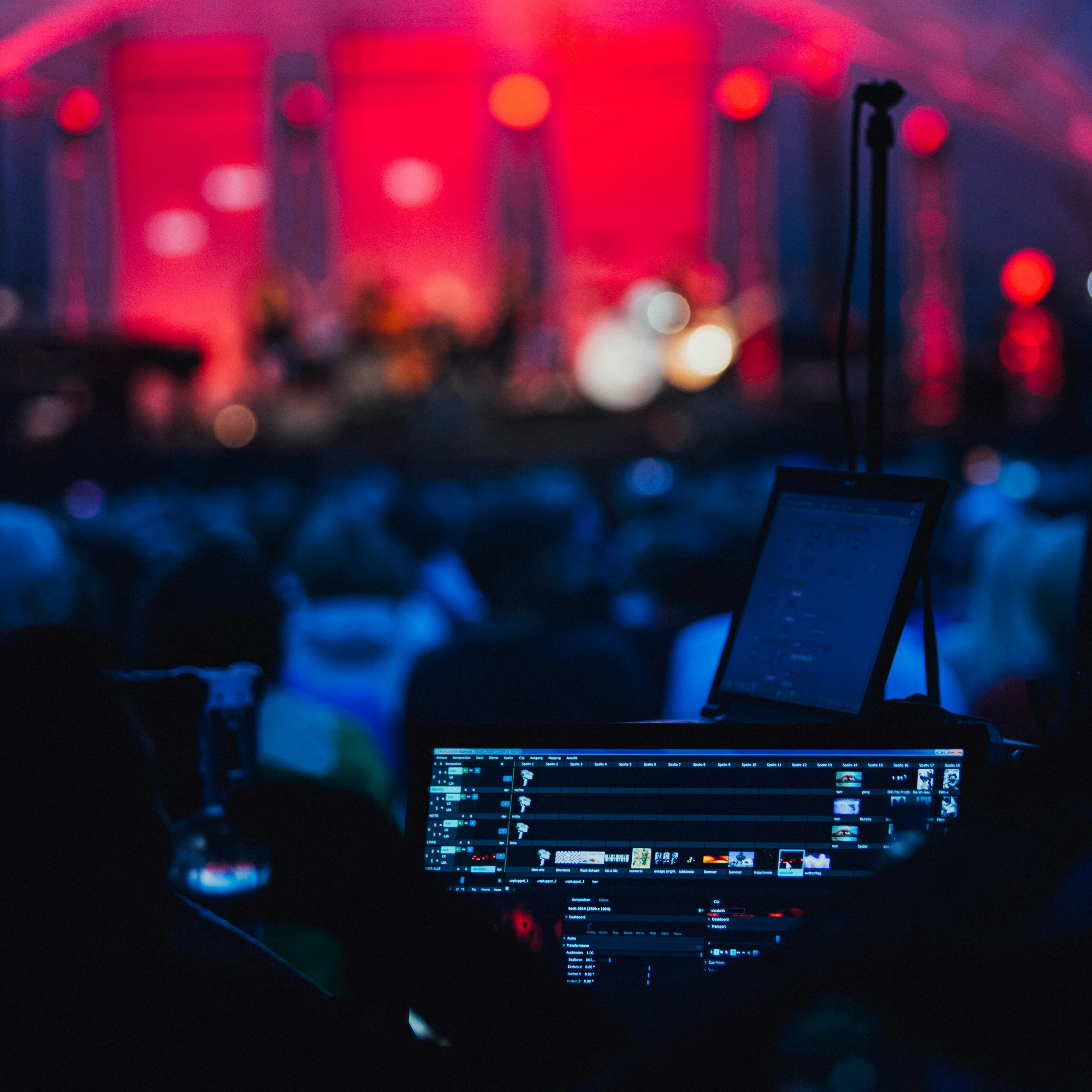 Sound board at a brightly lit corporate event.