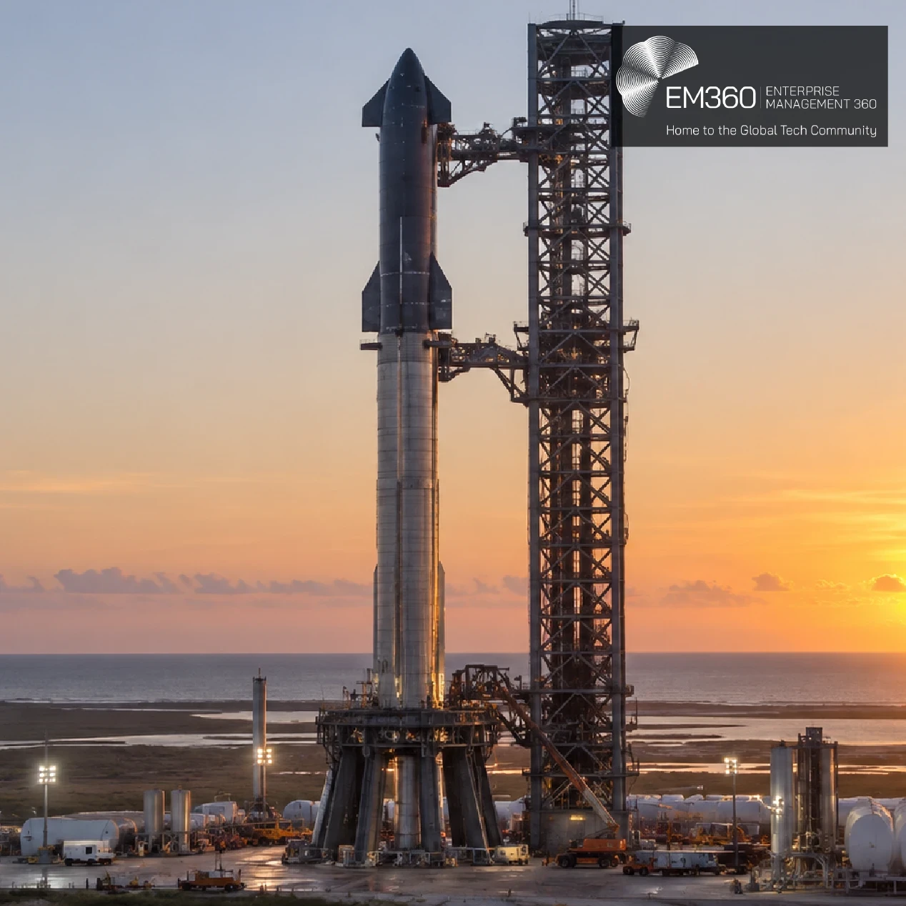 SpaceX Starship stands beside its launch tower at sunset, with a pale blue and orange sky over the coastal launch site. A dark translucent banner across the lower half reads “EM360TECH” and “SpaceX Signs Space Cargo for 2028 Starfall Return Mission” in large white text.