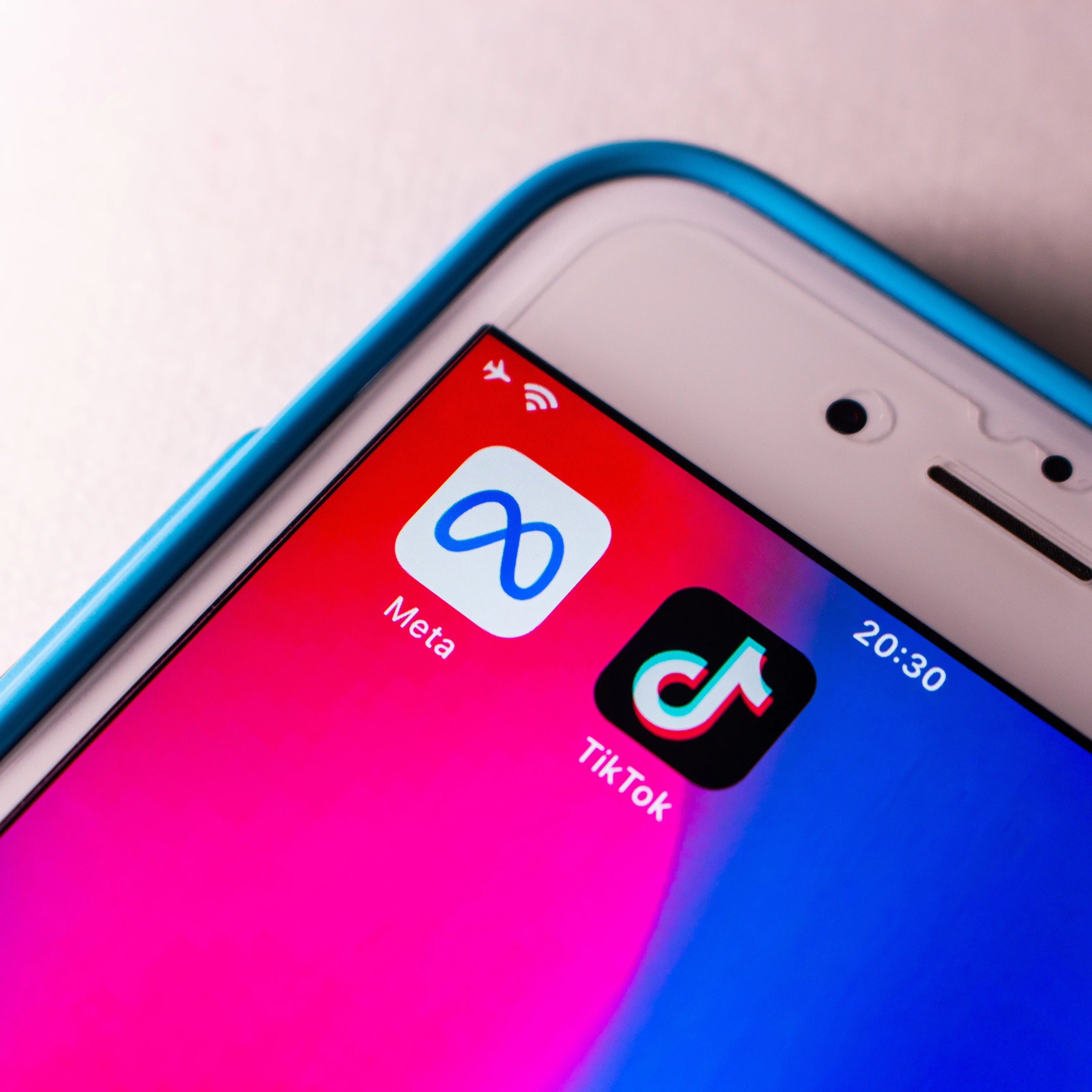 meta tiktok logos on phone banning ads