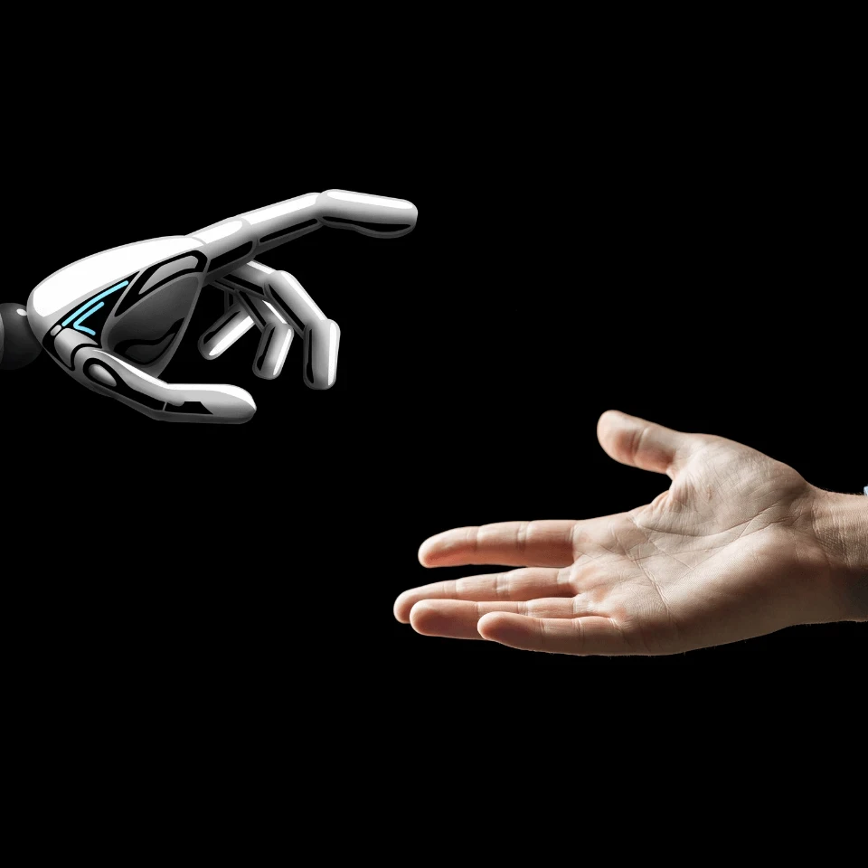 A robot hand and a human hand coming together.