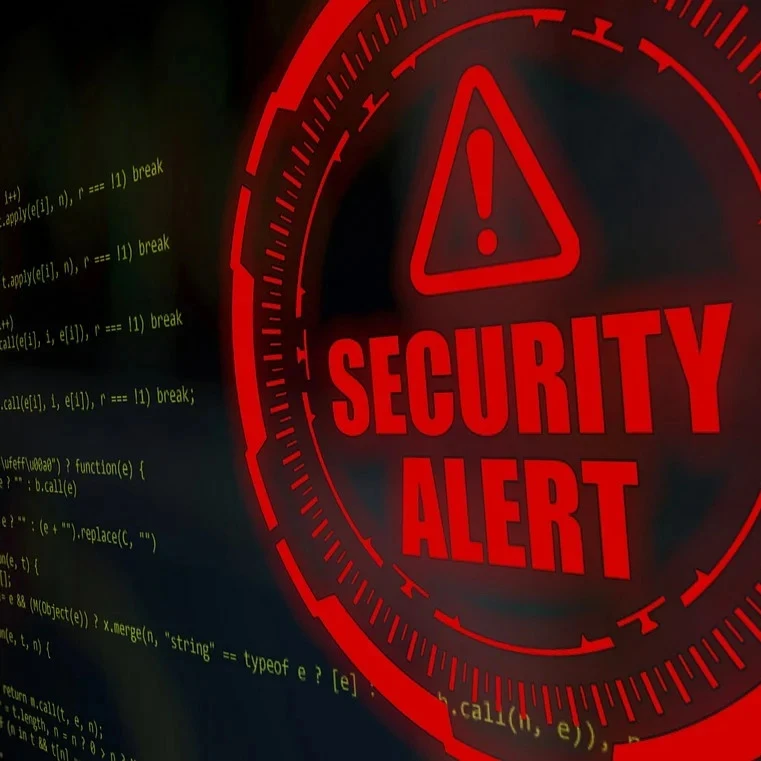 Bright red security alert on a screen with green code.