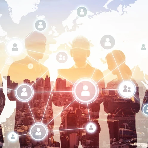 Silhouettes of businesspeople against a city backdrop with icons and profiles overlaid on top.