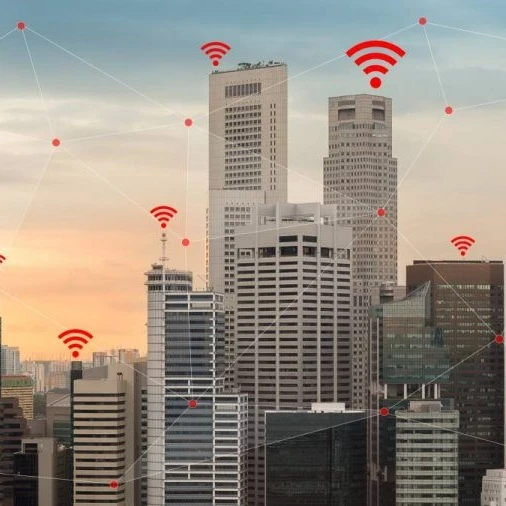 Skyscrapers in a city with WiFi connectivity symbol above each building