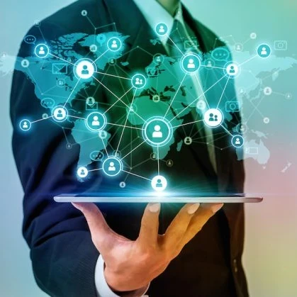 A person holding a tablet with a map of the world on it