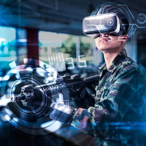 A person holding an imitation gun while using virtual reality goggles.
