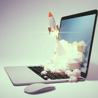 drawing of a rocket launching from a laptop