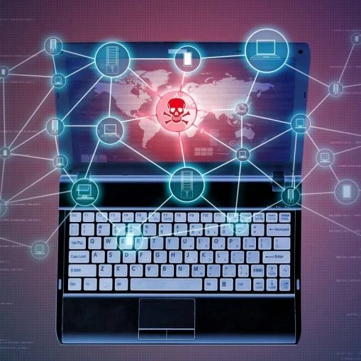 A red skull and cross bones on a laptop screen.