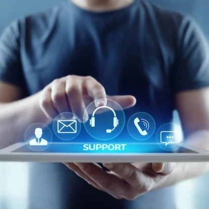 A person with a tablet pointing at the word "Support" with icons floating above.
