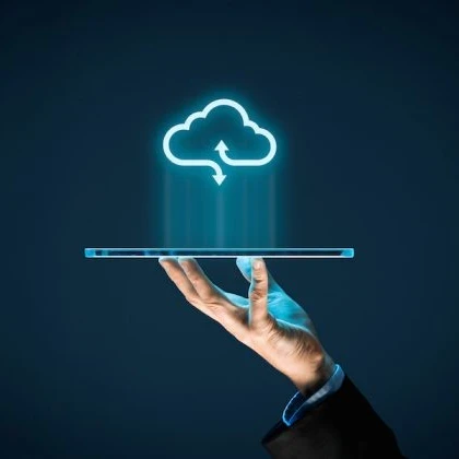 Hand holding up a tablet with a cloud icon floating above it.