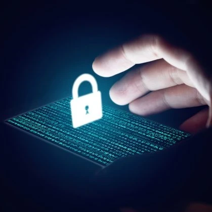 image of a smartphone with code on the screen and a graphic of a padlock floating above