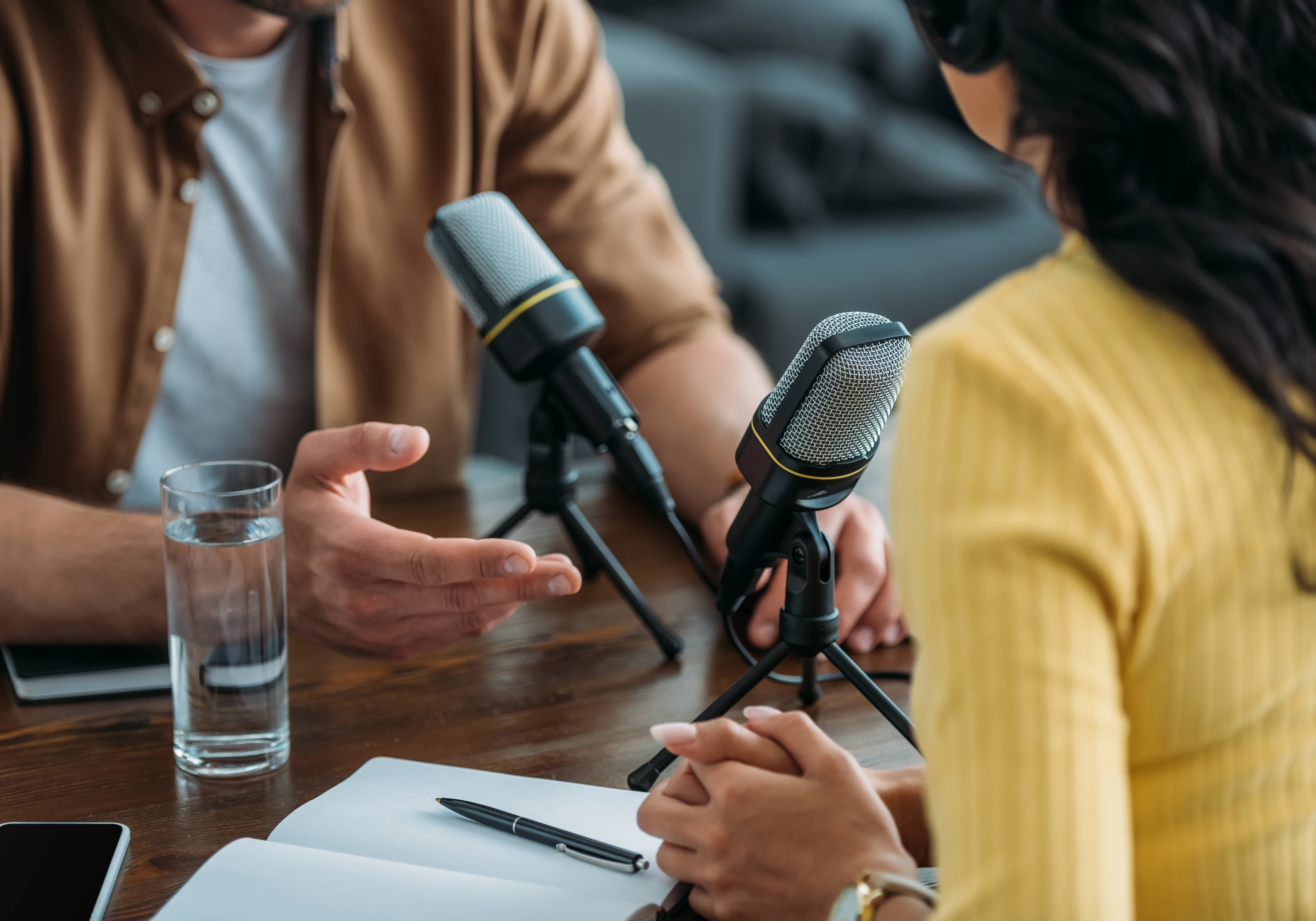 Two people recording a podcast